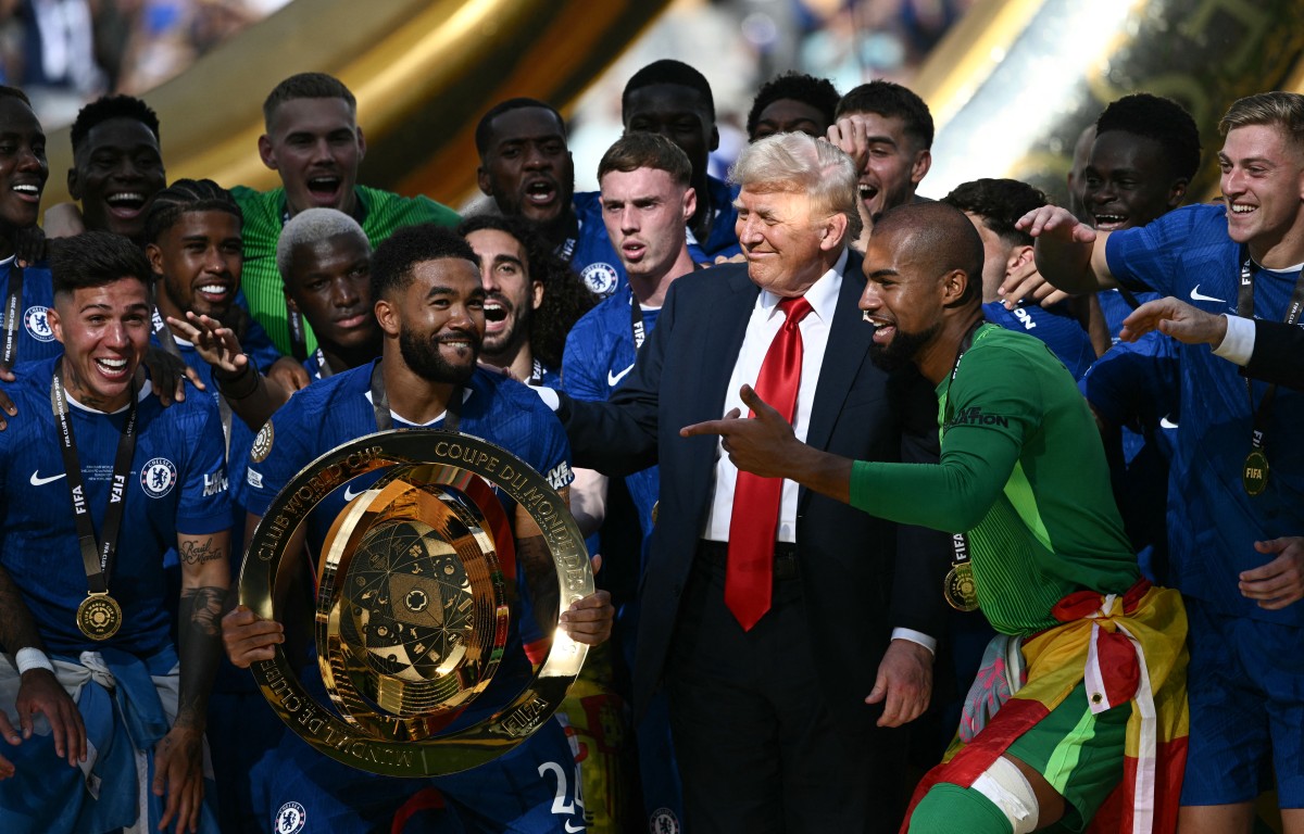 US President Donald Trump celebrates with Chelsea players after they won the Club World Cup in the US. (AFP)