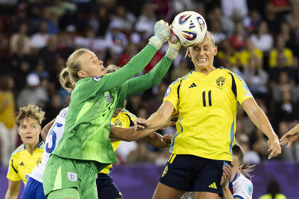 England’s goalkeeper Hannah Hampton, left, punches the ball away from Sweden’s Stina Blackstenius during the Women’s Euro 2025 quarterfinals between Sweden and England at Stadion Letzigrund in Zurich on Thursday. (AP)