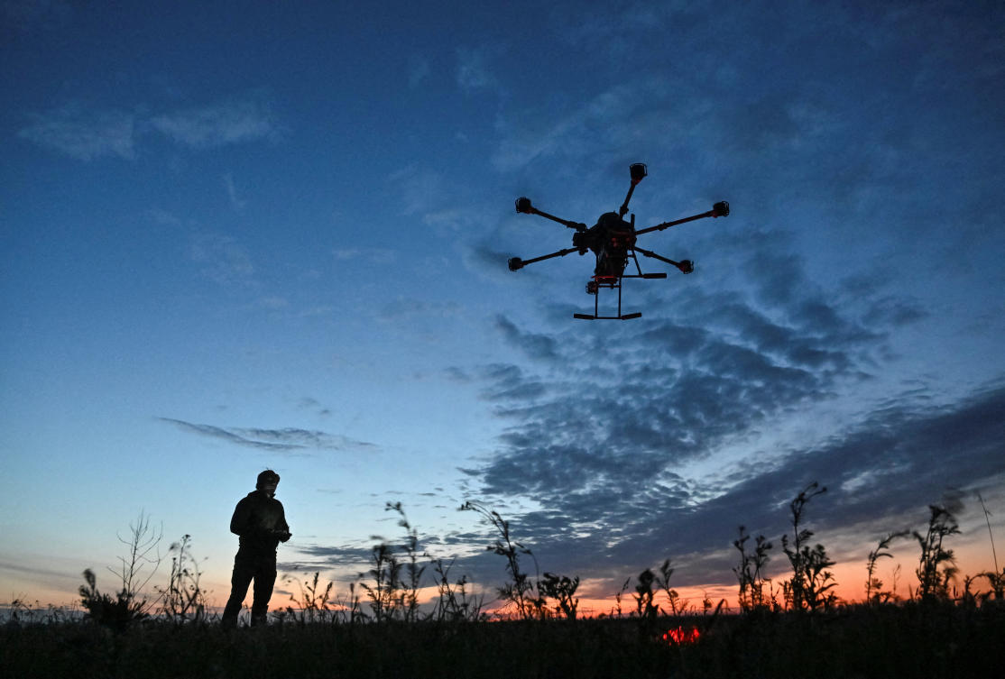 A Ukrainian serviceman launches a Vampire combat drone flying over positions of Russian troops on April 29, 2025. (Reuters)