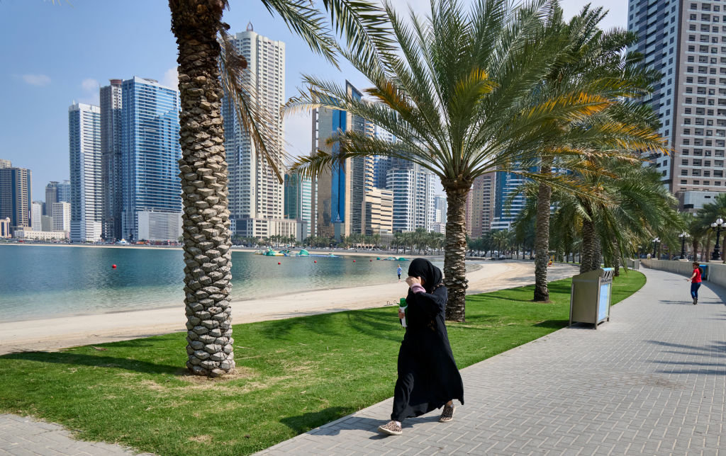 A woman walks by at Al Mamzar Beach on February 27, 2024, in Sharjah, United Arab Emirates. A study says the connection between rising temperatures and increasing cases of the four types of cancer was found to be significant in the UAE and five other Mideastern countries. (Corbis via Getty Images)