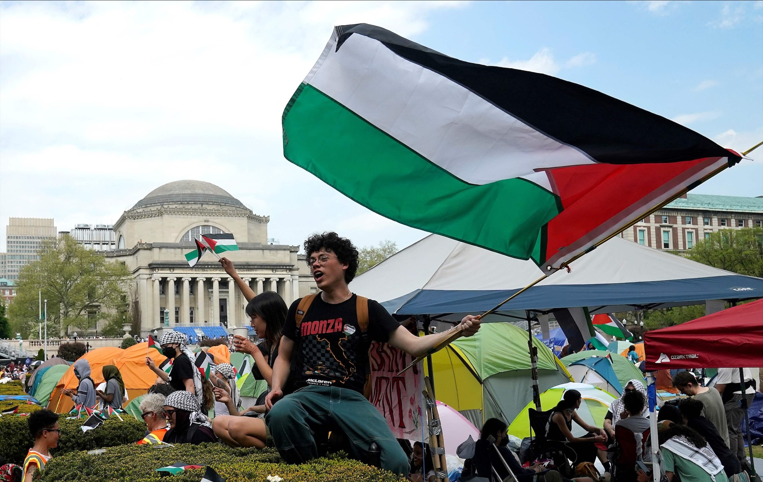 Protesters wave Palestinian flags on the West Lawn of Columbia University on April 29, 2024 in New York. (AFP)