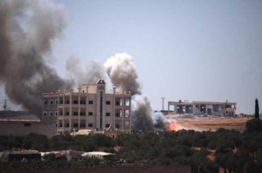 An ammunition depot explosion in Syria kills at least 12 people and wounds  more than 100