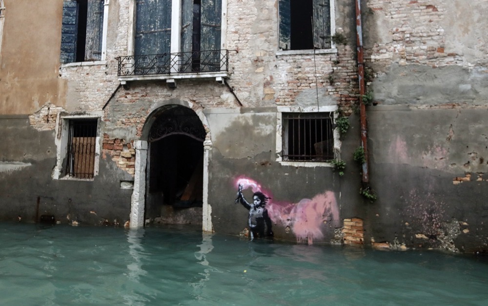 Banksy work ‘The Migrant Child’ removed from Venetian palazzo for restoration and future display