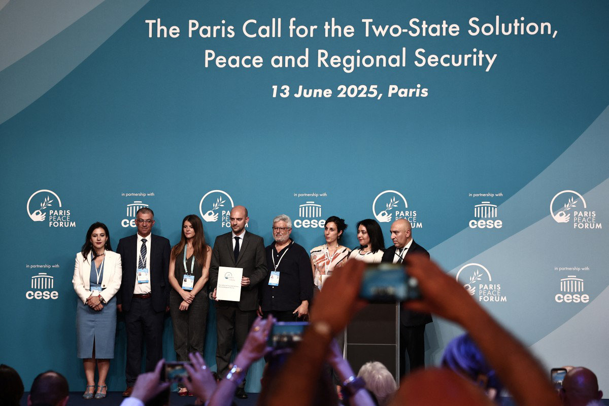 France's Minister for Europe and Foreign Affairs Jean-Noel Barrot (C) pose with participants during a conference dubbed "Paris Call for the Two-State Solution, Peace and Regional Security" gathering influential actors from Israeli and Palestinian civil societies committed to promoting the two-state solution, in Paris on June 13, 2025. (AFP/File)