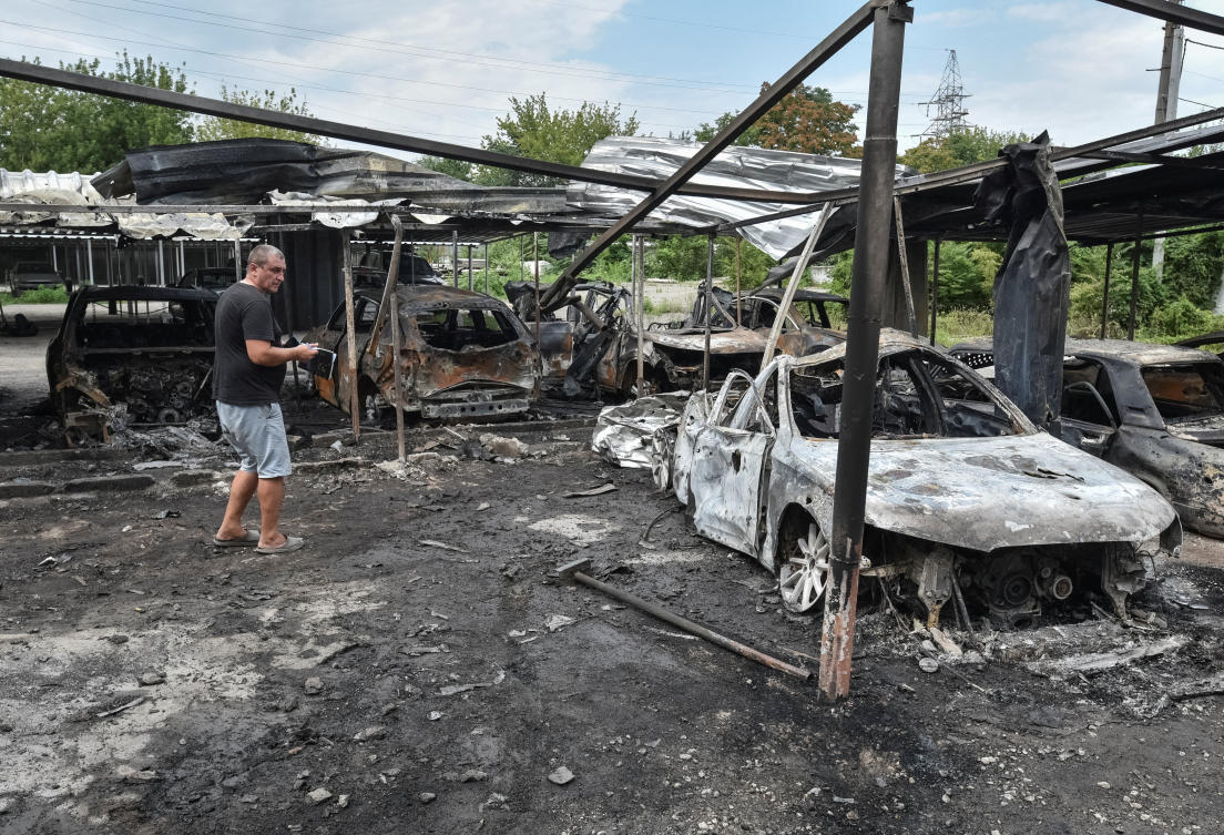 Deeper Russian advances could mean more attacks on one of Ukraine’s largest cities, Dnipro. Above, a resident stands next to burned cars at the site of a Russian drone strike in Dnipro, Ukraine on July 26, 2025. (Reuters)
