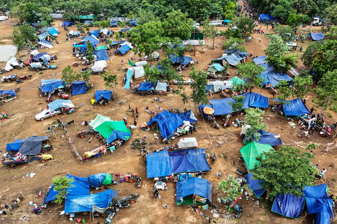 Above, an aerial view of people who fled their homes near the border area between Cambodia and Thailand, taking shelter near a pagoda in Oddar Meanchey province on July 26, 2025. (AFP)