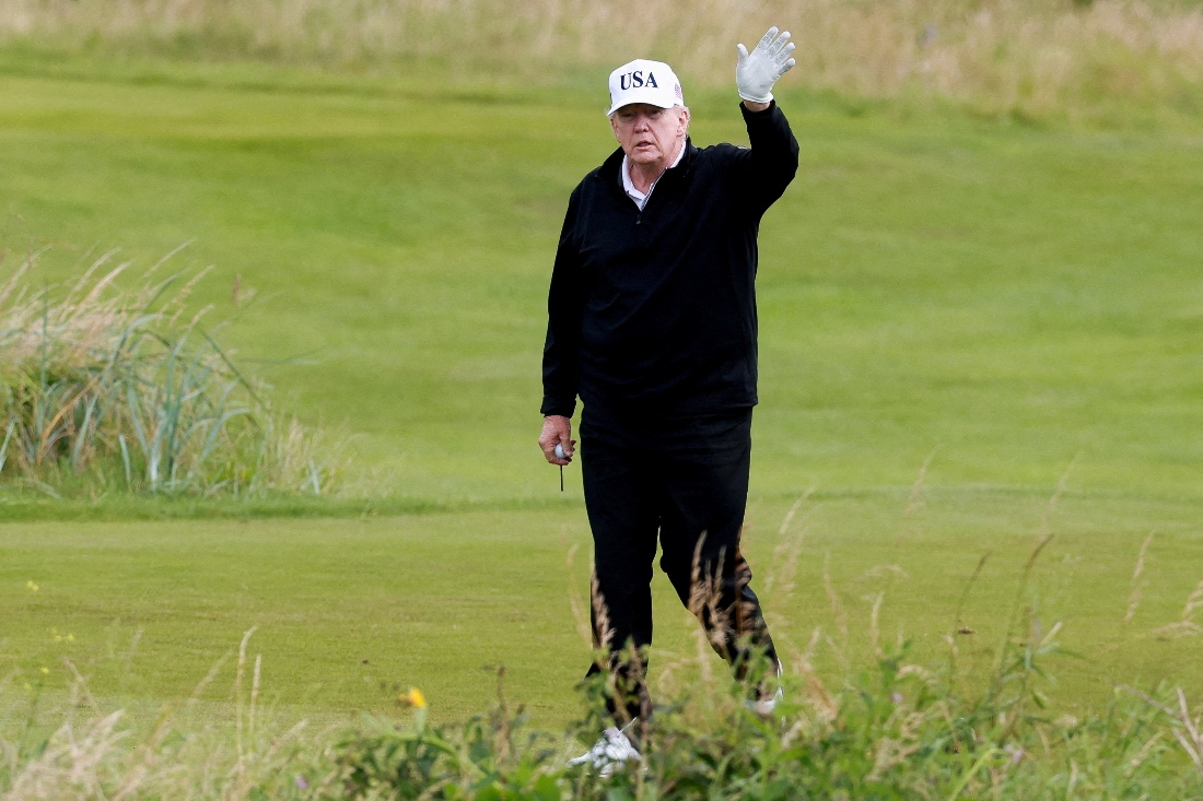 American President Donald Trump waves on the golf course at Trump Turnberry resort in Turnberry, Scotland. (Reuters)