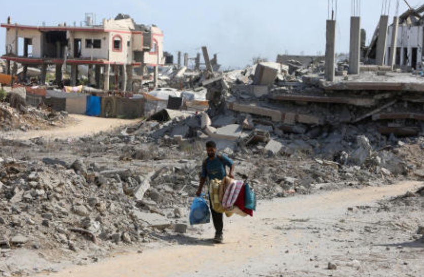 A Palestinian man walks near the rubble of houses destroyed during an Israeli raid, in western part of Nuseirat, central Gaza Strip, July 29, 2025. (Reuters)