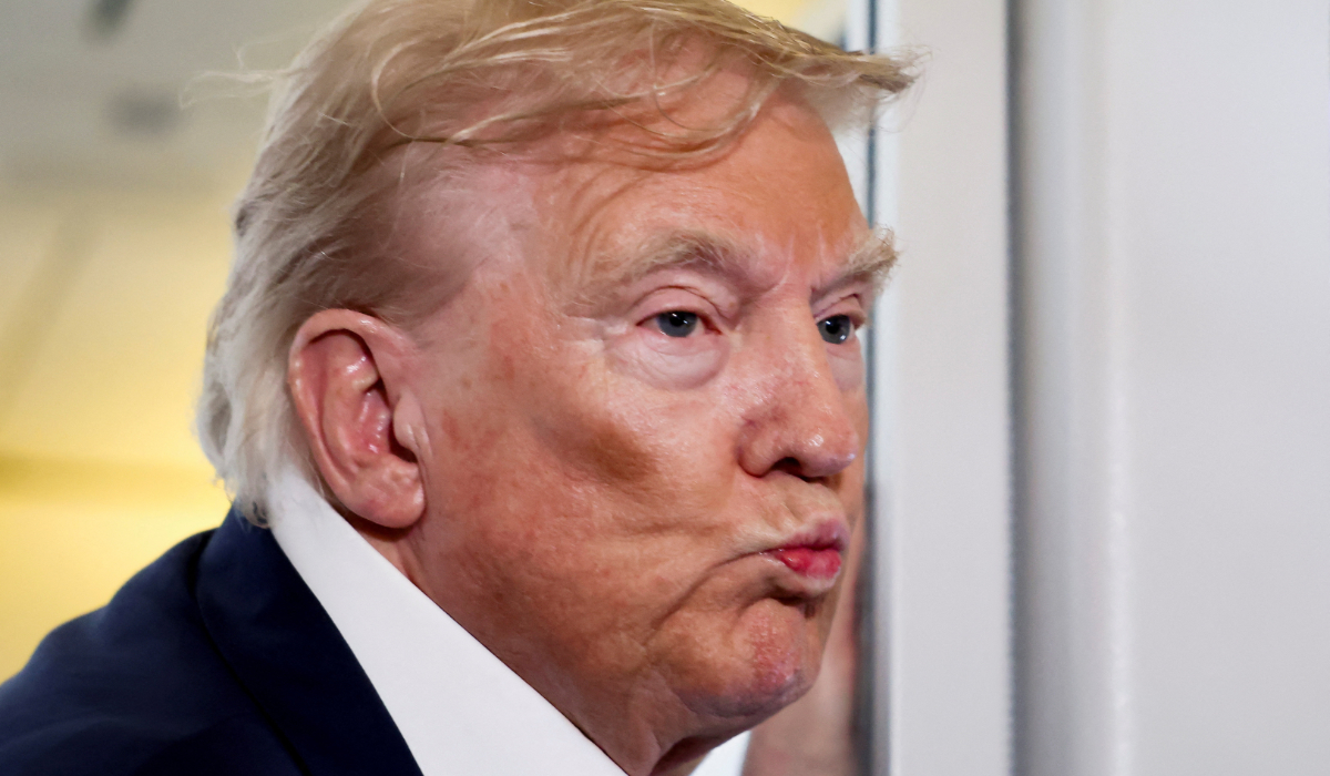 U.S. President Donald Trump reacts as he speaks to members of the media on board Air Force One en route from Scotland, Britain, to Joint Base Andrews, Maryland, U.S., July 29, 2025. (REUTERS)