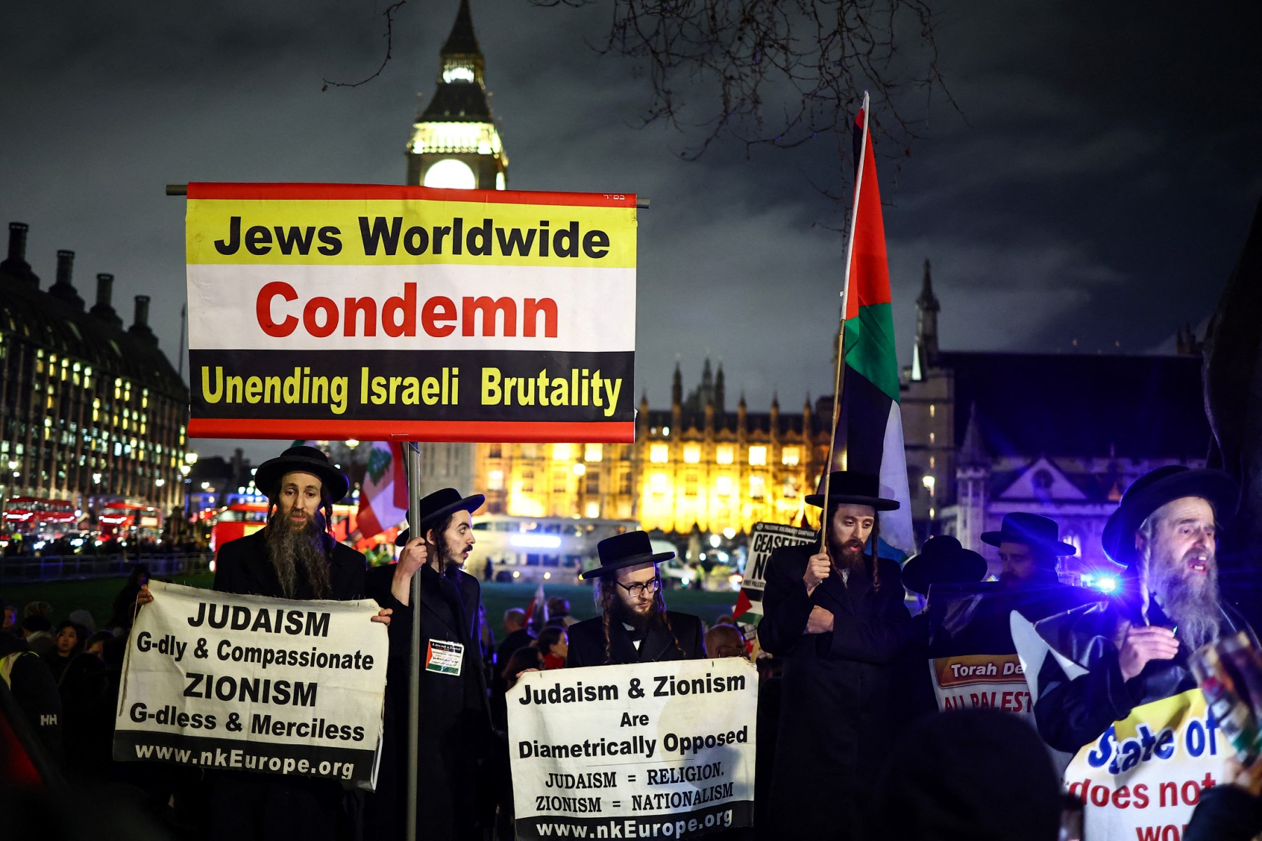 Members of the Ultra-Orthodox Jewish community hold placards as they protest in Parliament Square in London on February 21, 2024, during an Opposition Day motion in the the House of Commons calling for an immediate ceasefire in Gaza. (File/AFP)