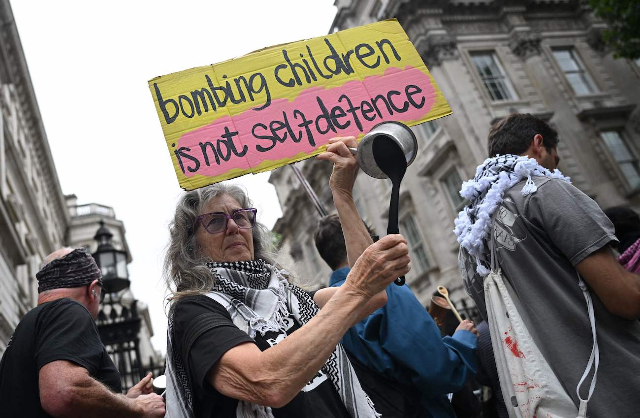 Protesters hold placards in support of Palestinians in Gaza amid fears of starvation in the territory outside Downing Street in London on July 29, 2025. (Reuters)