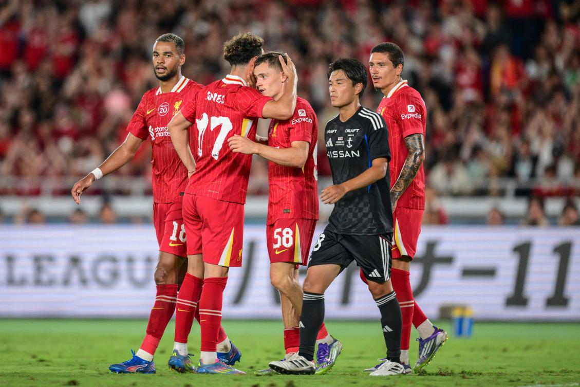 Liverpool’s Florian Wirtz celebrates with his teammates after scoring a goal during their friendly football against Japan’s J-League team Yokohama F. Marinos in Yokohama on July 30, 2025. (AFP)