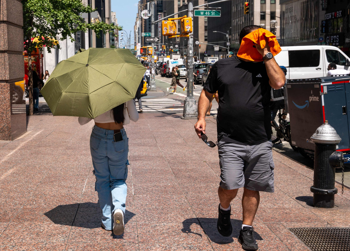 People try to stay cool on the sweltering streets of Manhattan as the region experiences another heatwave on July 29, 2025 in New York City. (Getty Images via AFP)