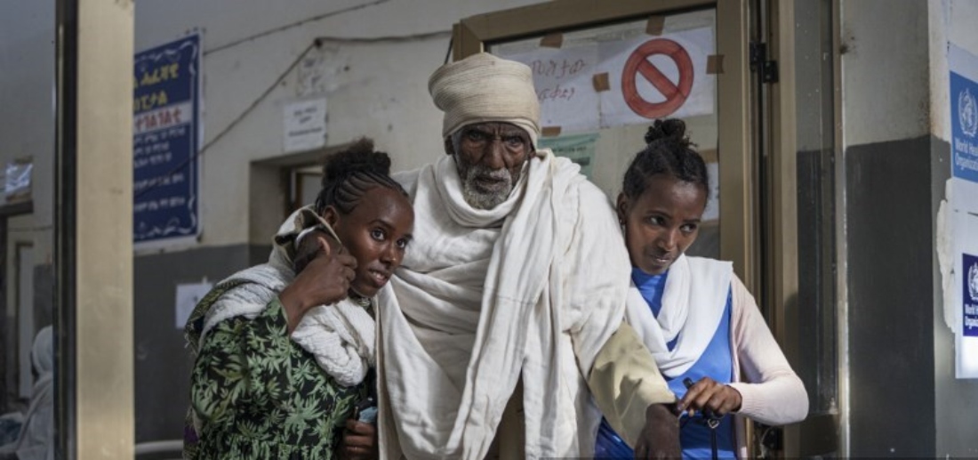 Two women carry a patient at the emergency ward of the Suhul General Hospital in Shire, Ethiopia. (AFP)