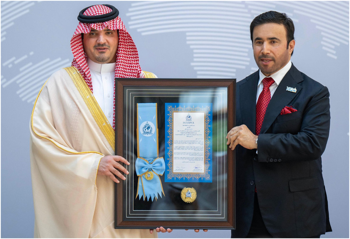 Prince Abdulaziz bin Saud bin Naif (left) receiving a plaque from Interpol president Ahmed Naser Al-Raisi at Interpol headquarters in Lyon, France on July 31, 2025. (SPA)