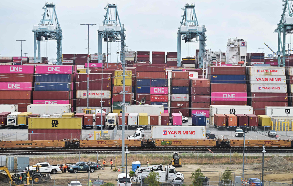 Shipping containers are stacked at the Port of Los Angeles, California, on May 6, 2025. President Donald Trump signed an order on July 31 imposing higher tariffs on dozens of countries in his latest bid to reshape global trade in favor of US businesses. (AFP)