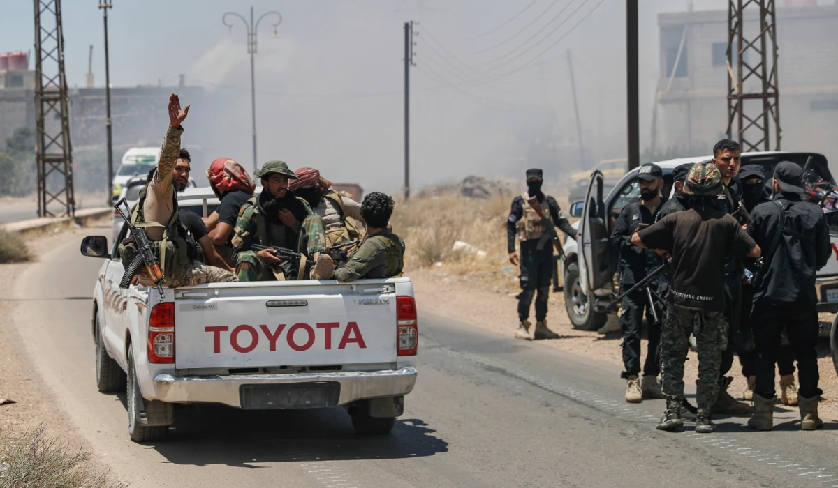 Syrian government forces gather at Mazraa village on the outskirts of Sweida city, southern Syria, Tuesday, July 15, 2025. (AP)