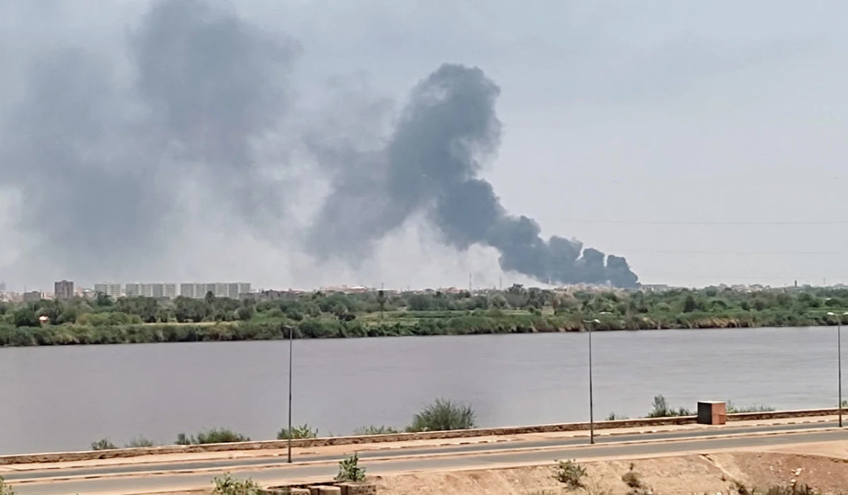 A picture taken from Omdurman shows smoke billowing in the distance in Khartoum North amid ongoing fighting in war-torn Sudan, on July 18, 2023. (AFP file photo)