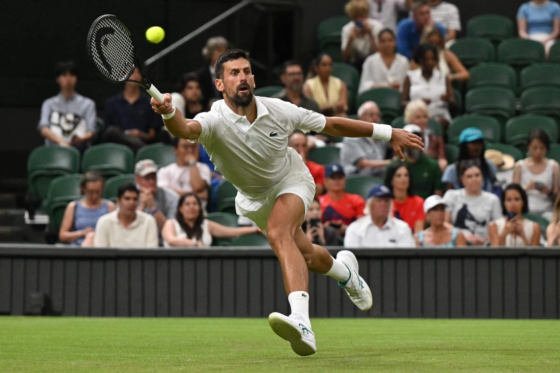 Serbia’s Novak Djokovic plays a forehand return to France’s Alexandre Muller during their men’s singles first round on the second day of the 2025 Wimbledon Championships at The All England Lawn Tennis and Croquet Club on Tuesday. (AFP)