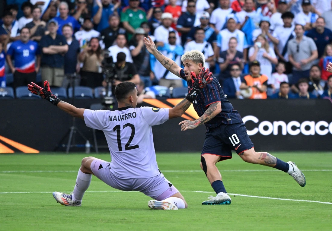 US midfielder Diego Luna (10) reacts after scoring a goal past Guatemala goalkeeper Kenderson Navarro during the first half of a semifinal match of the 2025 Gold Cup at Energizer Park Wednesday. (Joe Puetz-Imagn Images)