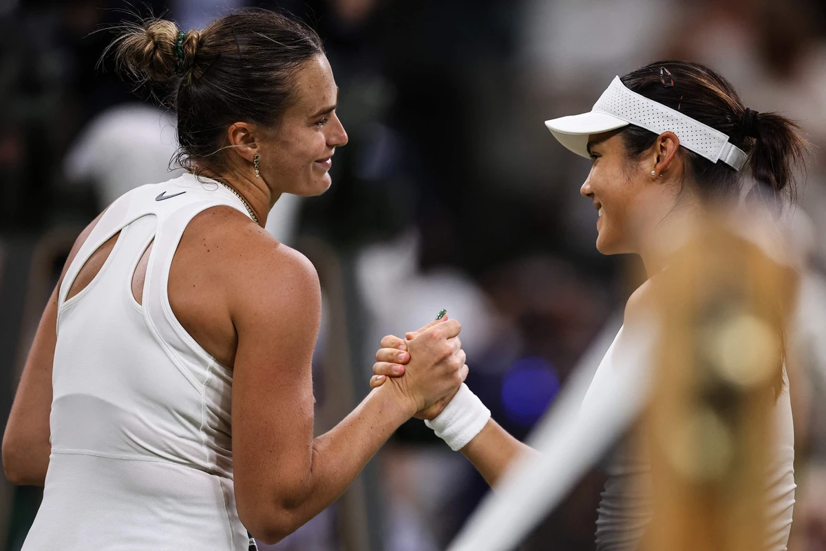 Aryna Sabalenka, left, shakes hands with Emma Raducanu at the end of their women’s singles third round t on the fifth day of the 2025 Wimbledon Championships on Friday. (AFP)