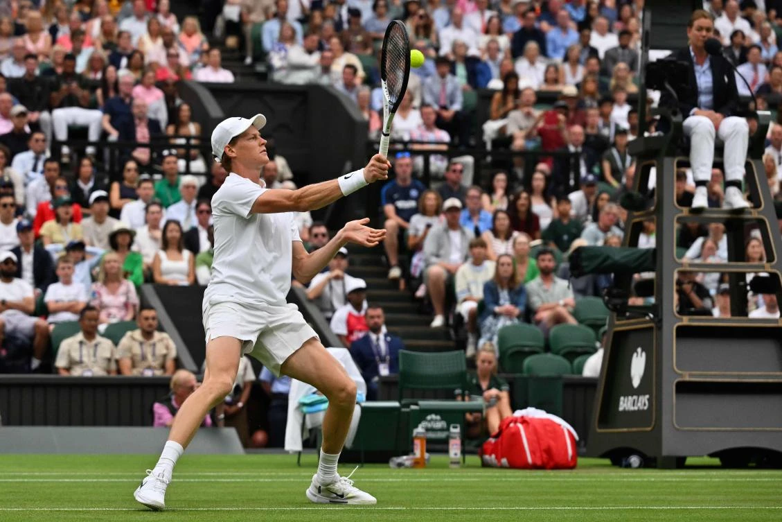 Italy’s Jannik Sinner plays a forehand return to Spain’s Pedro Martinez during their men’s singles third round tennis match on the sixth day of the 2025 Wimbledon Championships at The All England Lawn Tennis and Croquet Club in Wimbledon, on July 5, 2025. (AFP)