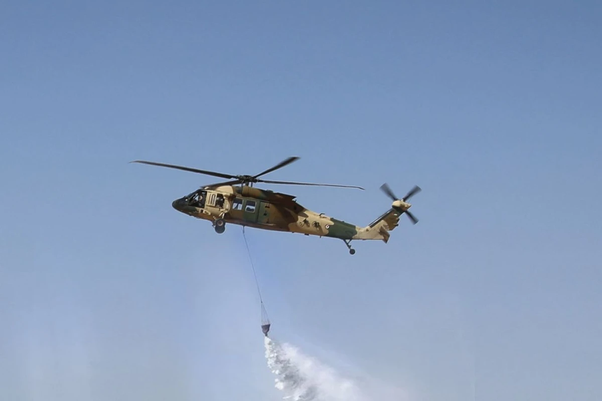 Two Jordanian helicopters with firefighting crews and equipment were dispatched to aid Syria in containing the wildfire in Latakia’s countryside on Sunday. (Petra)