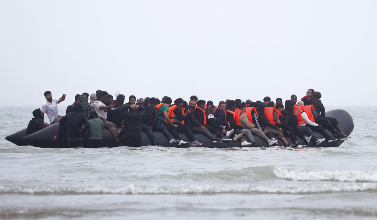 A group of migrants on an inflatable dinghy leave the coast of northern France in an attempt to cross the English Channel to reach Britain, from the beach of Petit-Fort-Philippe in Gravelines, near Calais, France, July 2, 2025. (REUTERS)