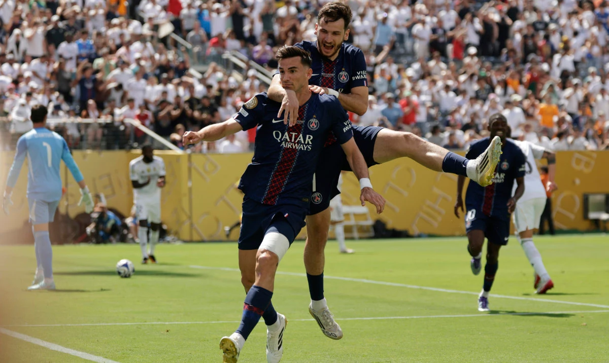 Paris Saint-Germain's Fabian Ruiz celebrates with team mate Khvicha Kvaratskhelia after scoring his side's opening goal during the Club World Cup semifinal soccer match between PSG and Real Madrid in East Rutherford, N.J., Wednesday, July 9, 2025. (AP)