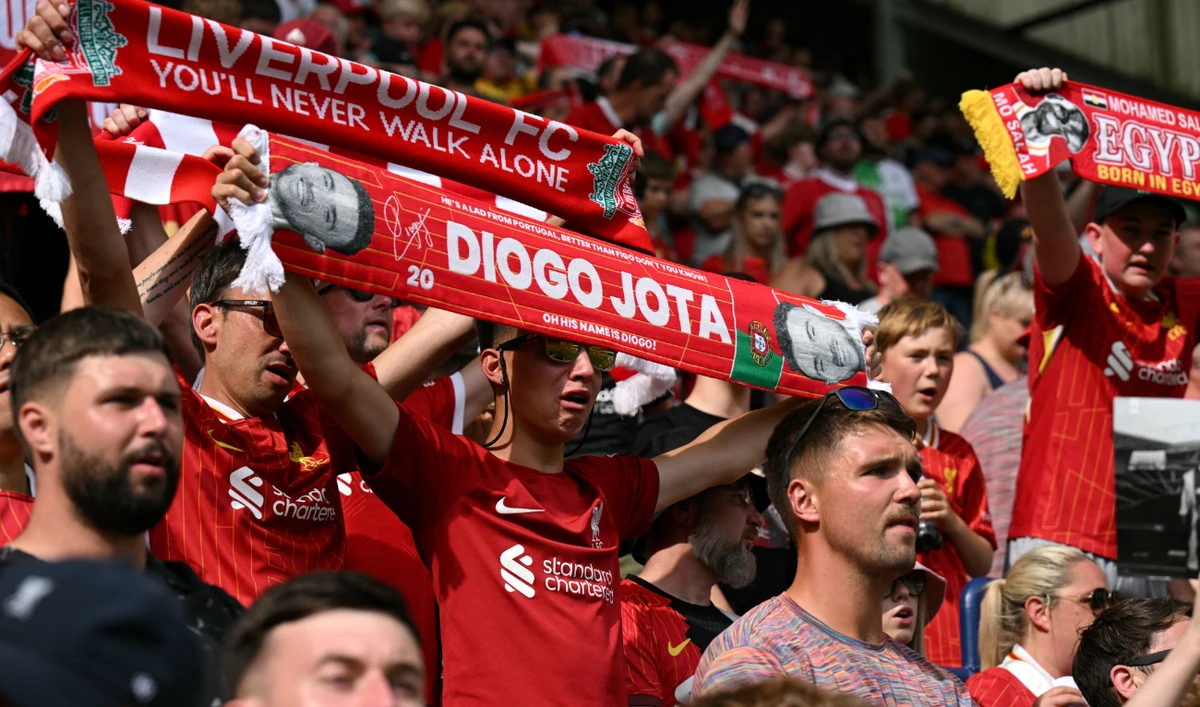 Fans remember Liverpool's late Portuguese striker #20 Diogo Jota following the pre-season friendly football match between Preston North End and Liverpool at Deepdale stadium in Preston, north-west England on July 13, 2025. (AFP)