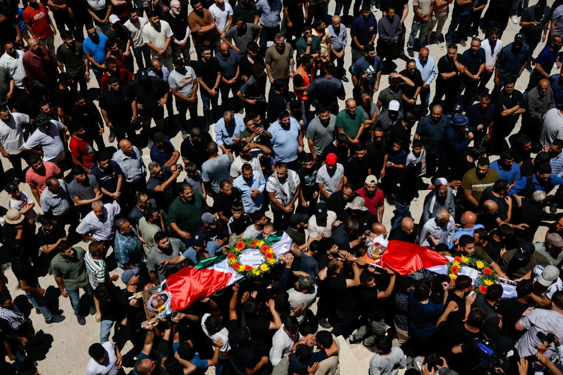 People carry the bodies of Sayfollah Kamel Musallet, a Palestinian-American man who was beaten to death by settlers, and Mohammad Al-Shalabi, a man who was shot dead by Israeli forces, according to the Palestinian Health Ministry, during their funeral near Ramallah, in the West Bank Jul. 13, 2025. (Reuters)