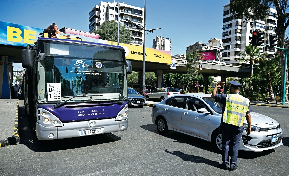Navy-blue buses, main, operated by a private contractor were voluntarily upgraded with safety and tracking tech, despite no contract requirement. (AFP file)