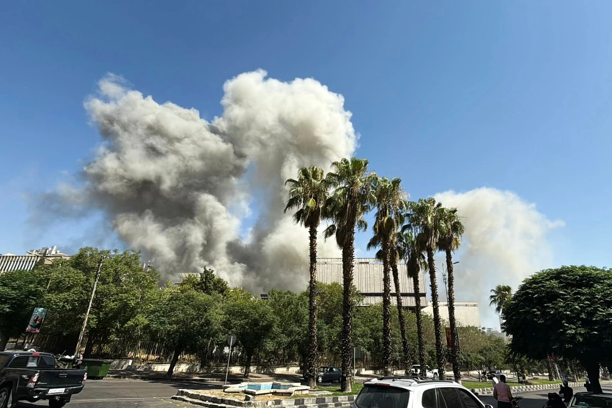 Smoke billows following Israeli strikes near the Syrian army and defence ministry headquarters in Damascus, July 16, 2025. (AFP)