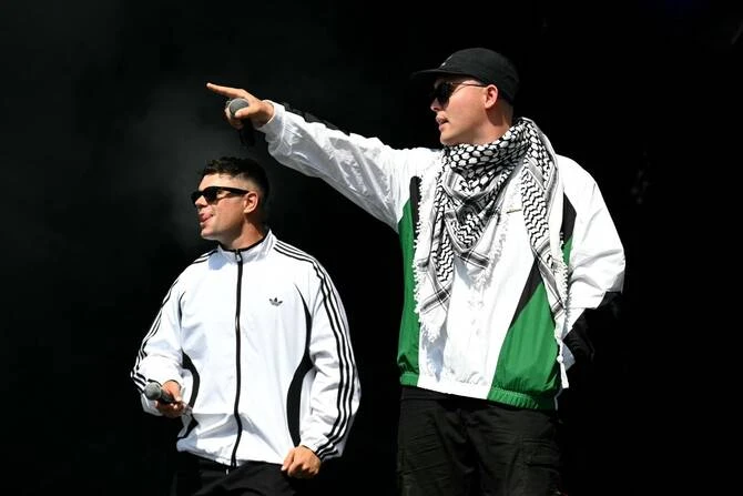 A town that hosts one of France's biggest pop festivals announced Wednesday that it was withdrawing its subsidy to the event because controversial Irish rappers Kneecap had been booked to play. (AFP/File)