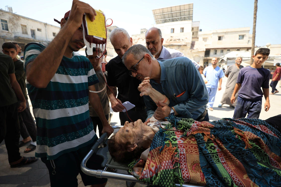 A wounded Palestinian Christian woman is brought into at Al-Ahli Arab Hospital following an Israeli strike on The Church of the Holy Family, according to medics, in Gaza City July 17, 2025. (REUTERS)