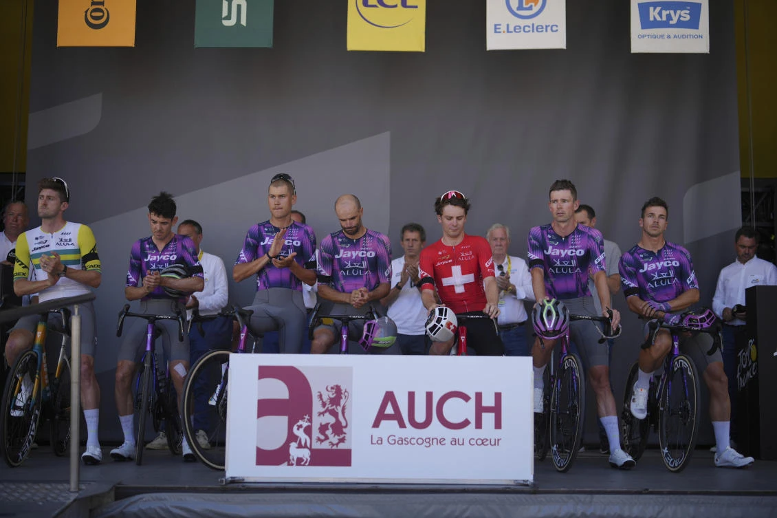 Team Jayco Alula mourns the death of Italian cyclist Samuele Privitera before the start of the twelfth stage of the Tour de France cycling race over 180.6 kilometers (112.2 miles) with start in Auch and finish in Hautacam, France, July 17, 2025. (AP)