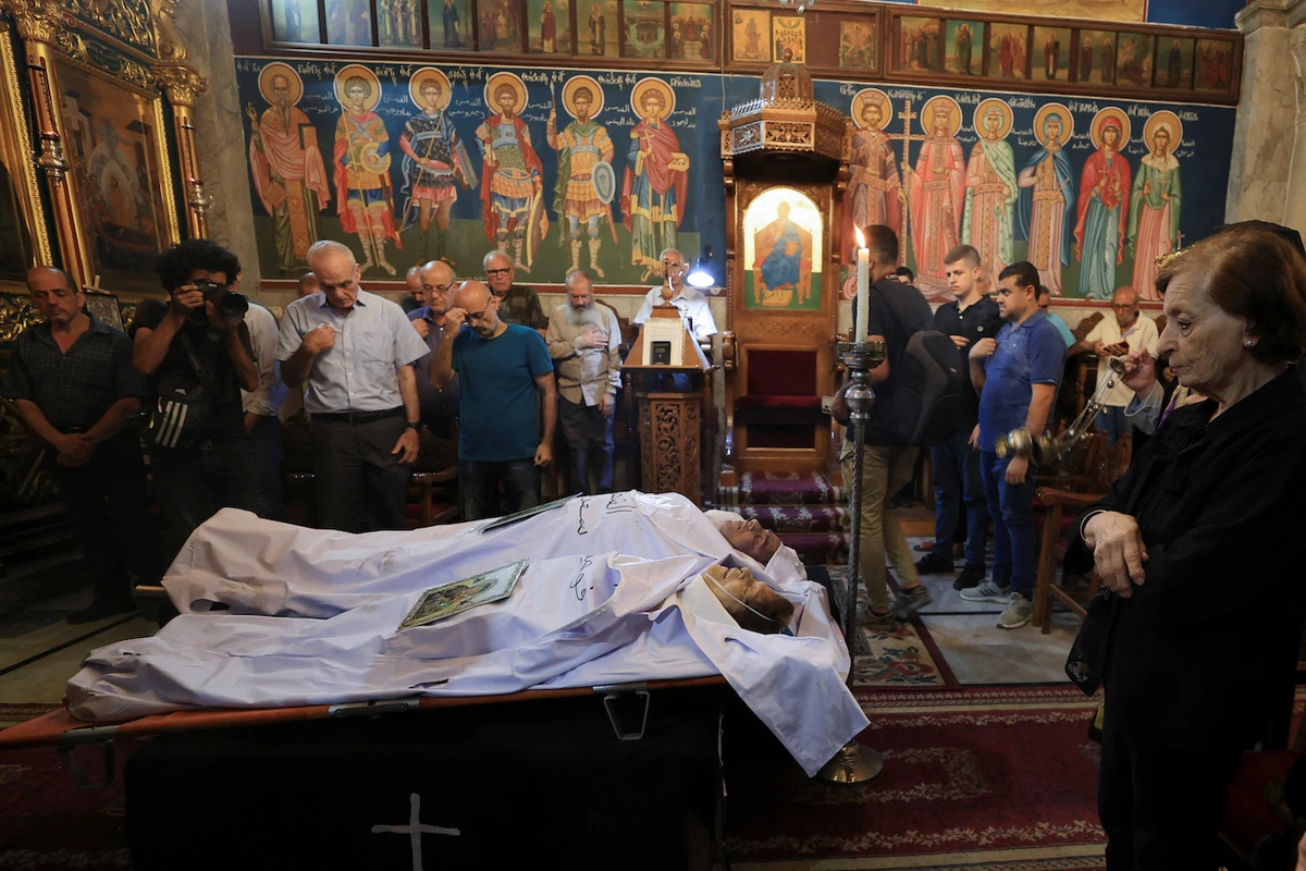 Mourners attend the funeral of two Palestinian Christians who were killed in an Israeli strike on the Holy Family Church, at the Greek Orthodox Saint Porphyrius Church, in Gaza City, July 17, 2025. (Reuters)
