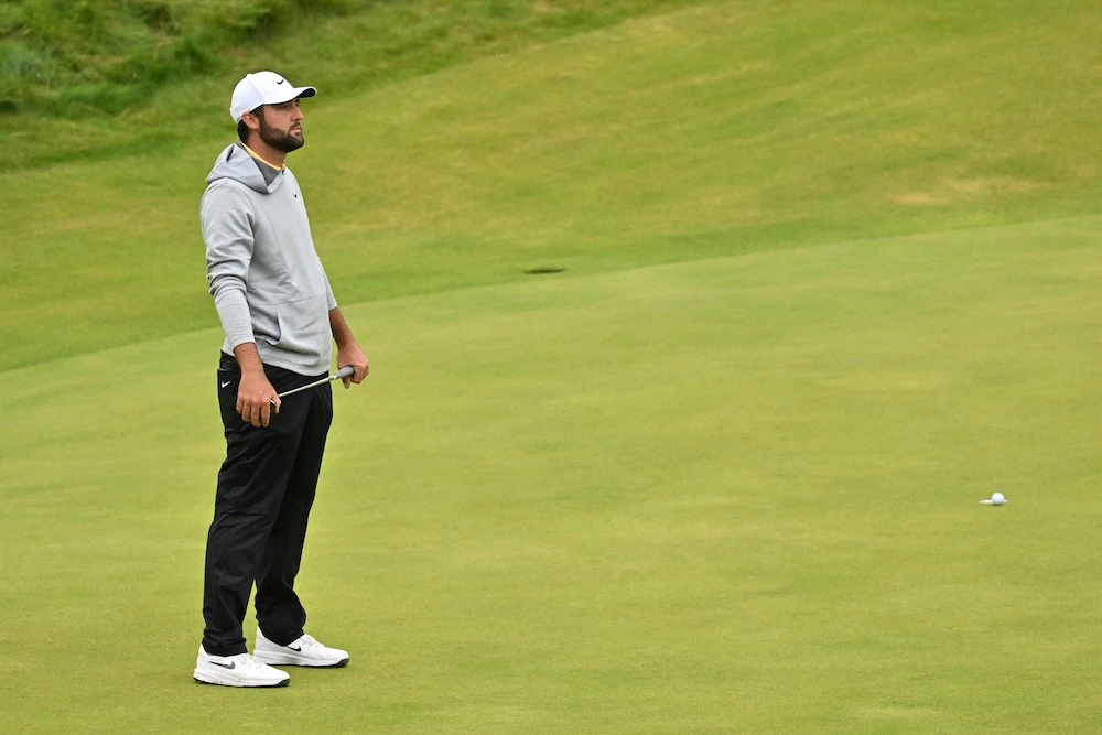 US golfer Scottie Scheffler reacts after missing the course record when his putt failed to drop on the 18th green on Day 2 of the 153rd Open Championship at Royal Portrush golf club in Northern Ireland on Friday. (AFP)