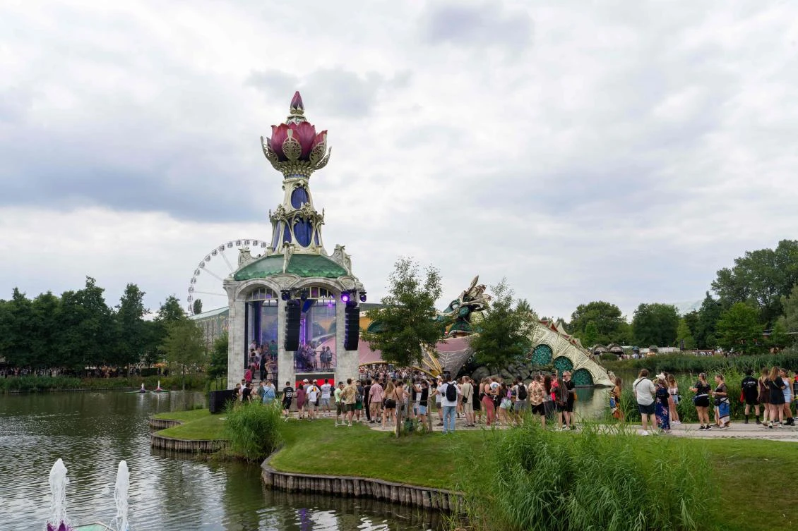Festival-goers attend the first day of the Tomorrowland electronic music festival, in Boom, northern Belgium on July 18, 2025. (AFP)