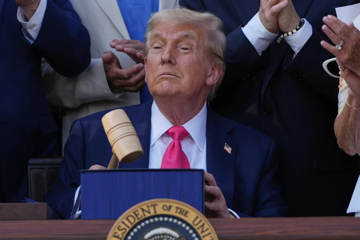 US President Donald Trump holds a gavel after he signed his signature bill of tax breaks and spending cuts at the White House in Washington on July 4, 2025. (AP)