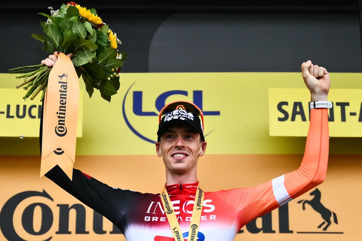 INEOS Grenadiers team’s Dutch rider Thymen Arensman celebrates on the podium after winning the 14th stage of the Tour de France cycling race, 182.6 km between Pau and Luchon-Superbagneres, in the Pyrenees mountains of southwestern France, on Saturday. (AFP)
