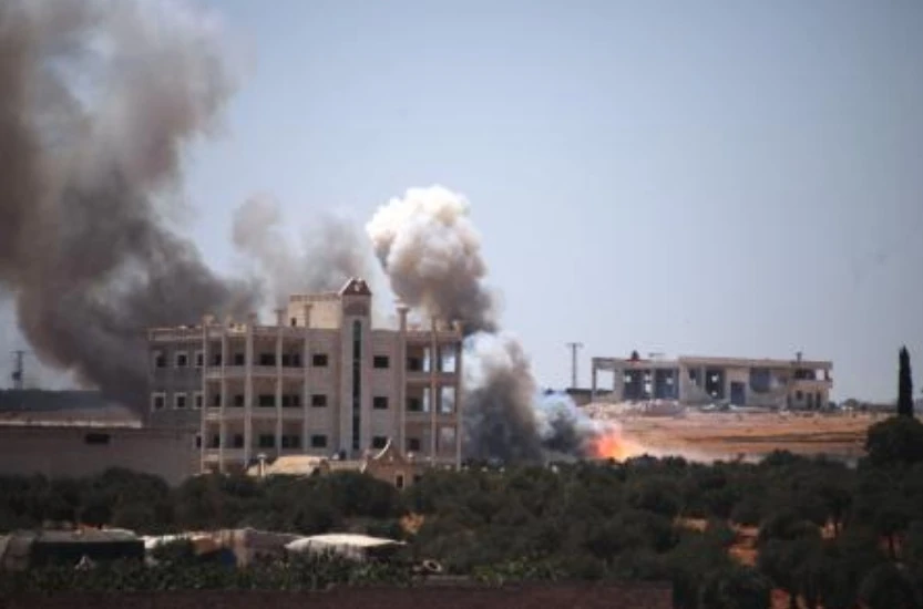 An ammunition depot explosion in Syria kills at least 12 people and wounds  more than 100