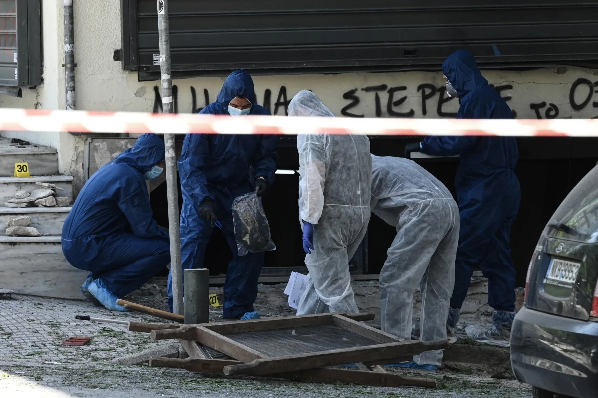 Greek police experts search for evidence after a bomb explosion in Thessaloniki on May 3, 2025.