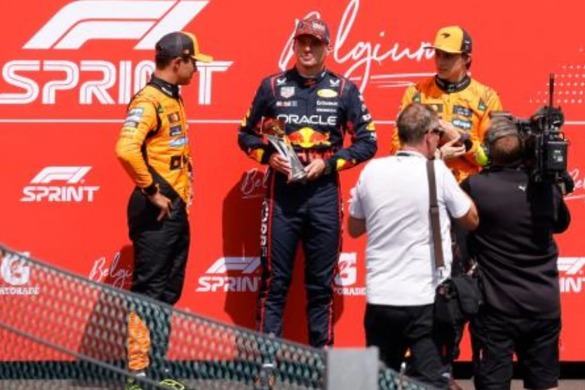 First placed Red Bull Racing’s Dutch driver Max Verstappen (C) holding the Sprint Race trophy poses with second placed McLaren’s Australian driver Oscar Piastri (R) and third placed McLaren’s British driver Lando Norris after the Sprint Race of the Formula One Belgian Grand Prix at the Spa-Francorchamps circuit in Spa, on July 26, 2025. (AFP)