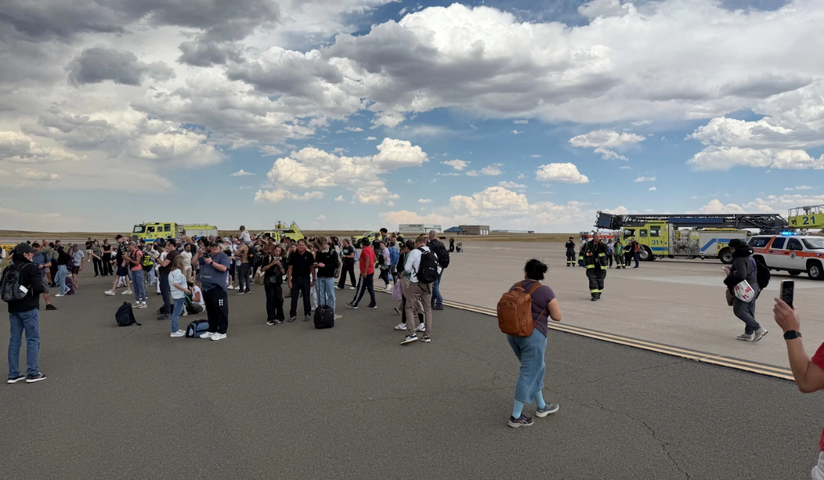 Passengers gather after evacuating an American Airlines plane that caught fire, at the Denver International Airport, Denver, Colorado, U.S. July 26, 2025, in this picture obtained from social media. (REUTERS)