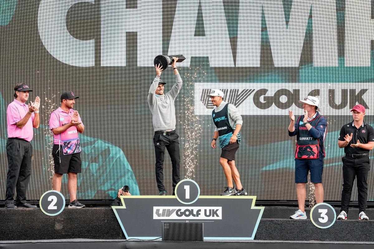 First-place individual champion captain JoaquÃn Niemann, center left, of Torque GC, and caddie Diego Salinas, center right, celebrate near second-place individual champion captain Bubba Watson, left, of RangeGoats GC, and caddie Kyle Peters, second from left, and third-place individual champion Caleb Surratt, right, of Legion XIII, and caddie Sean McDonagh, second from right, on the podium following the final round of LIV Golf United Kingdom at JCB Golf & Country Club, Sunday, July 27, 2025 in Rocester, England. (LIV Golf via AP)