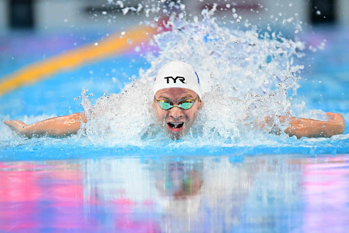 France's swimmer Leon Marchand competes in a heat of the men's 200m individual medley swimming event during the 2025 World Aquatics Championships in Singapore on July 30, 2025. (AFP)