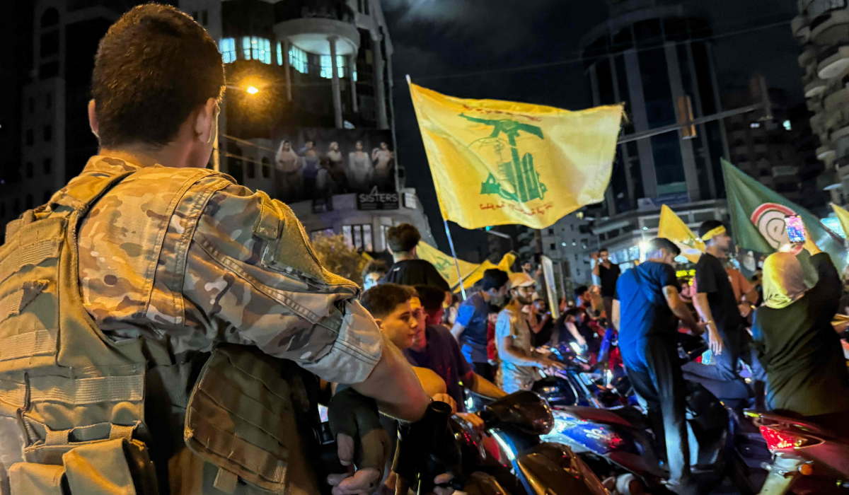 Supporters of Lebanon's militant group protest in Beirut against the government's endorsement of a disarmament plan. (AFP)