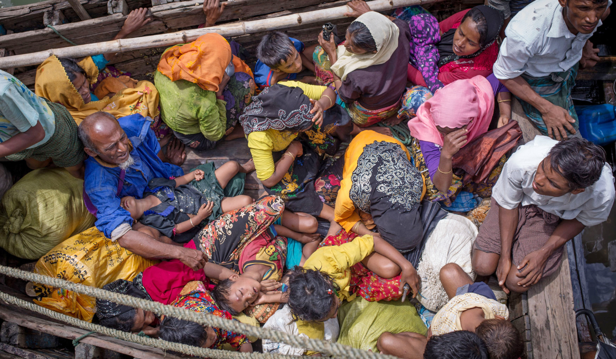 Rohingya refugees arriving by boat at Shah Parir Dwip in Bangladesh after fleeing violence in Myanmar. (AFP)