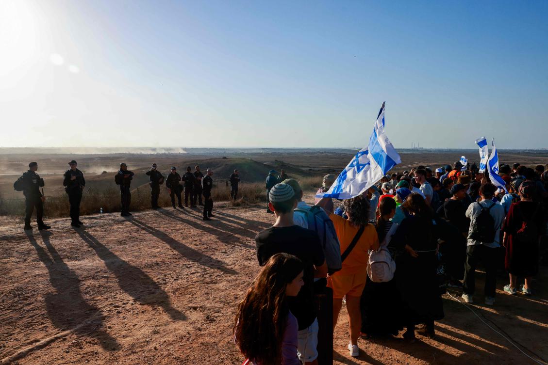Several Israeli far-right groups are holding a rally under the slogan “20 years later, we’re coming back to the Gaza Strip,” a day after far-right Finance Minister Bezalel Smotrich said Israel should reoccupy Gaza. (AFP)